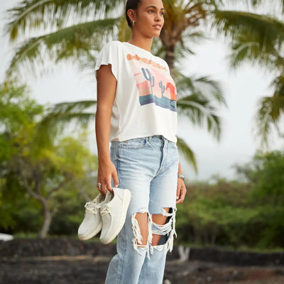 Woman in graphic tee and ripped jeans with Ariat Womens Hilo Casual Shoes for outdoors