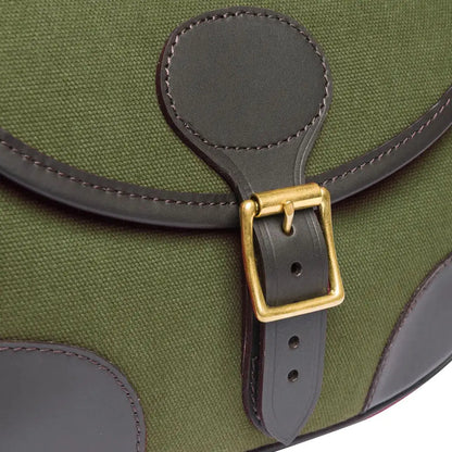 Green canvas bag with leather trim and brass buckle for hunting and outdoors trips