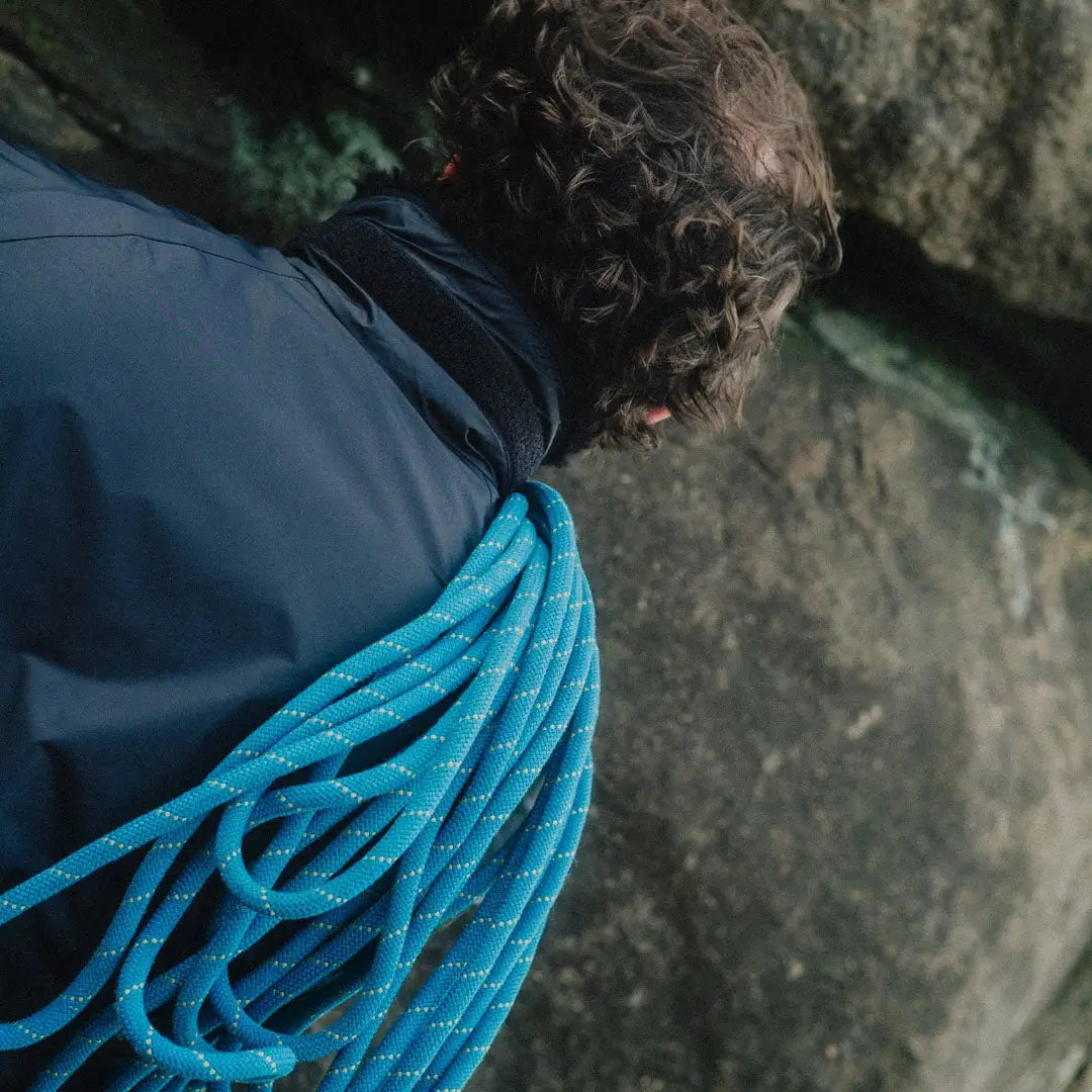 Blue coiled climbing rope with white speckles for Buffalo Belay Jacket or belay jacket use