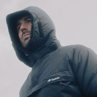 Black Buffalo DP Hood puffer jacket worn by a man, showcasing enduring strength and skillfully created design