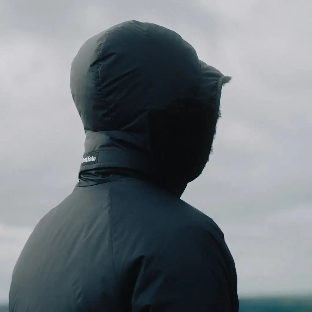 Person in buffalo dp hood jacket with aquatherm pile lining and hood up
