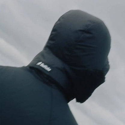Person in a buffalo dp hood jacket with aquatherm pile lining for warmth