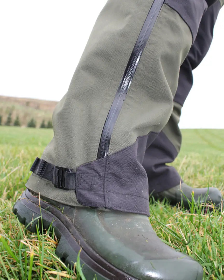 Bushbuck Defender waterproof bib overtrousers with waterproof pants over rubber boots for tough outdoor use