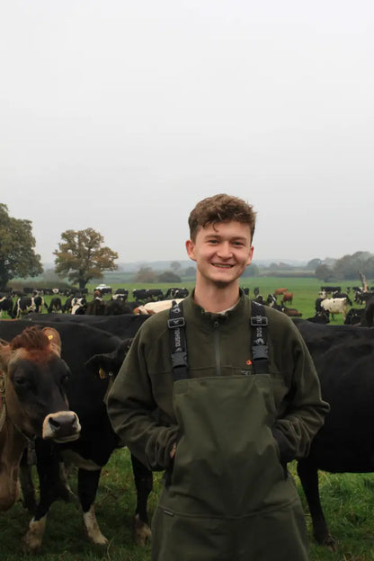 Smiling farmer in Bushbuck Defender Waterproof Bib Overtrousers wearing defender jacket