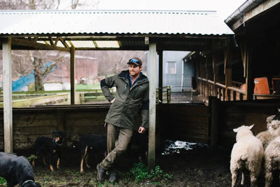Man in outdoor country clothing wearing Bushbuck Defender Waterproof Jacket for hunting