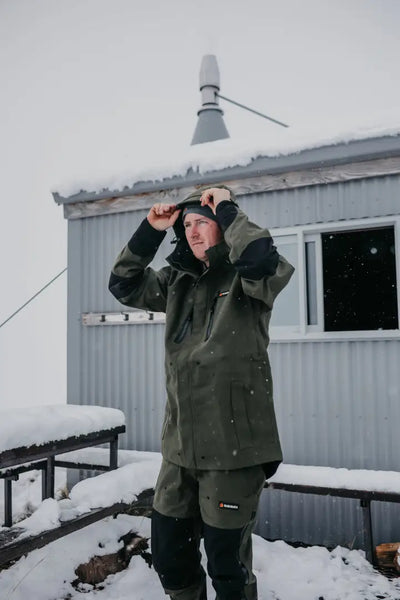Man in olive green Bushbuck Defender Waterproof Trousers for hunting and country clothing