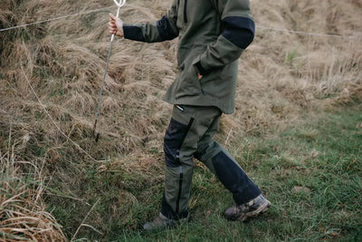 Person in outdoor country clothing wearing Bushbuck Defender Waterproof Trousers for hunting