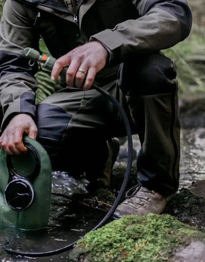 Green water container with hose for Bushbuck Defender Waterproof Trousers outdoor gear