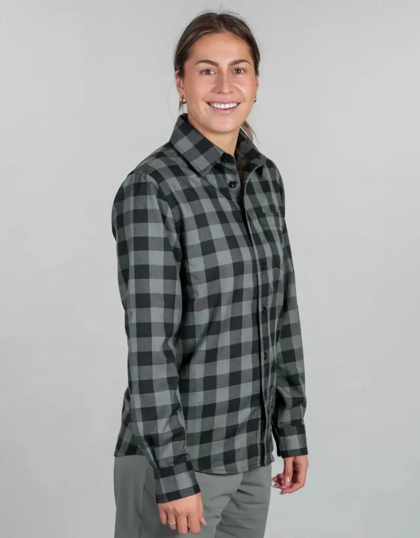 Woman wearing Bushbuck Flannel Shirt with gray and black plaid design, perfect flannel shirt style