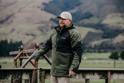 Man in green and black Bushbuck Frontier Windproof Fleece Pullover with chest pocket, great country clothing