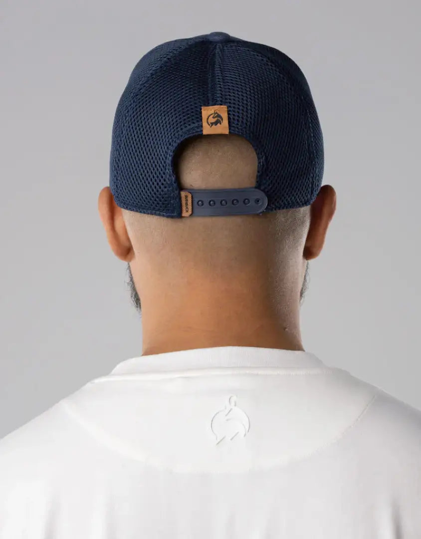 Bushbuck snapback trucker cap in navy blue with brown leather strap