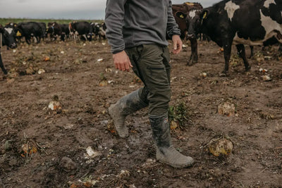 Muddy rubber boots paired with Bushbuck Venture Pants 2.0 for outdoor adventures