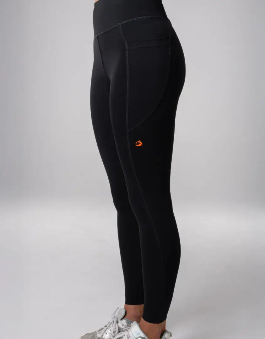 Bushbuck Womens Ascent Leggings: black high-waisted with orange logo for outdoors
