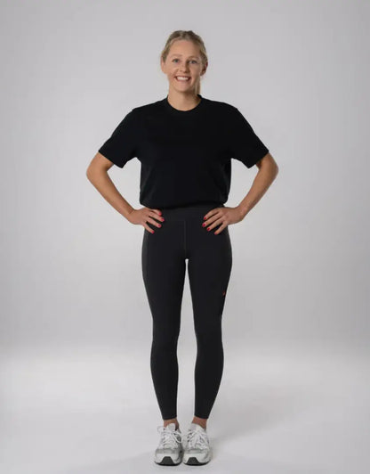 Bushbuck Womens Ascent Leggings in black with white sneakers for outdoors hunting