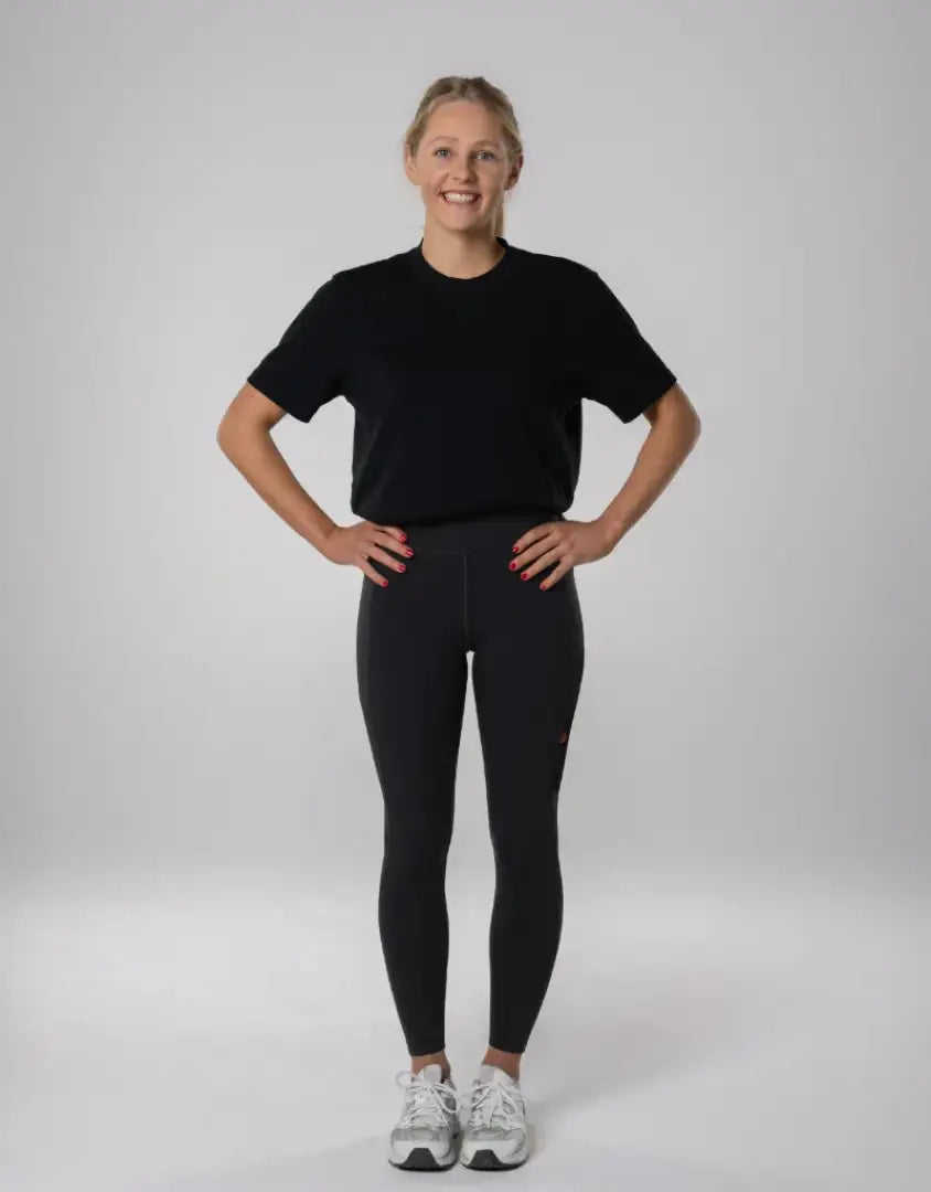 Bushbuck Womens Ascent Leggings in black with white sneakers for outdoors hunting