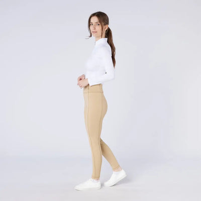 Woman in white top and tan season tights, perfect for country clothing and hunting