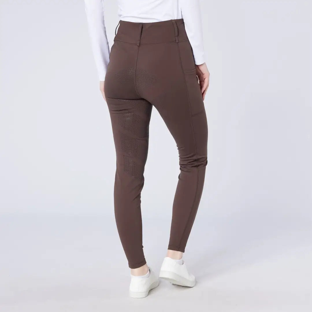 Person wearing Cameo All Season Tights with dark brown high-waisted skinny pants and white sneakers