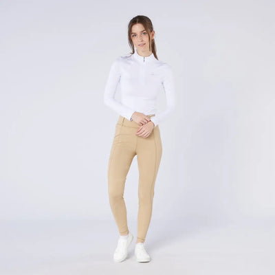Woman in white long-sleeve top and tan pants wearing Cameo All Season Tights for country clothing