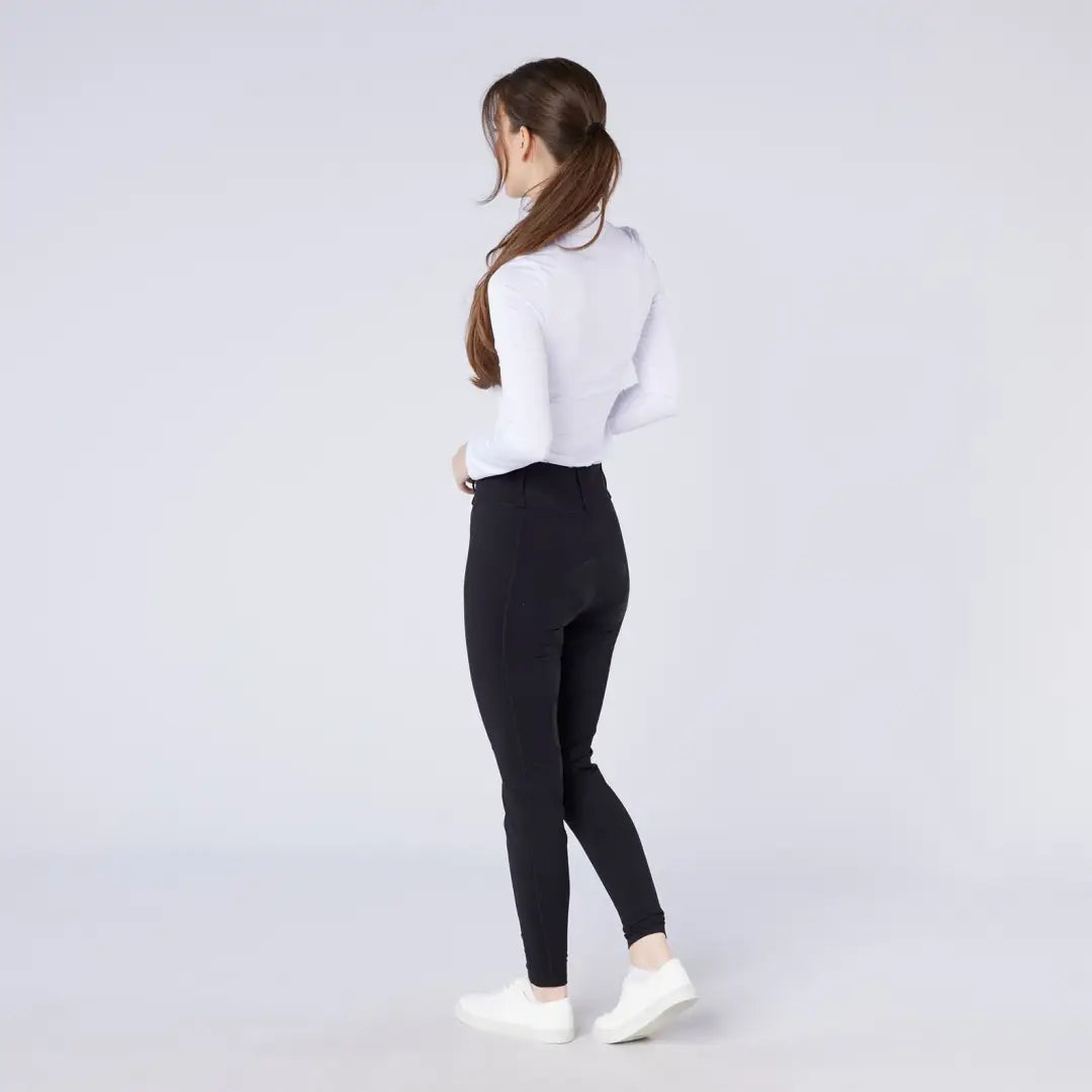 Women’s white long-sleeved top and black leggings outfit featuring Cameo All Season Tights for country clothing and hunting style
