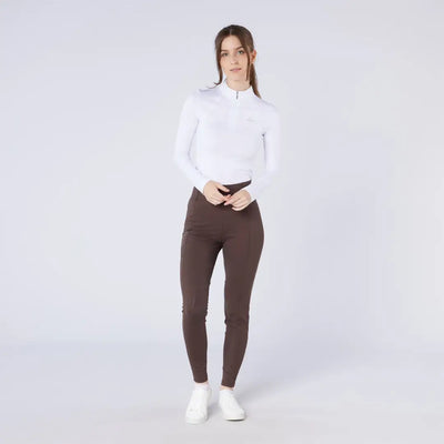 Woman in white top and brown hunting season tights for country clothing style