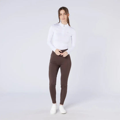 Woman in white top and brown hunting season tights for country clothing style