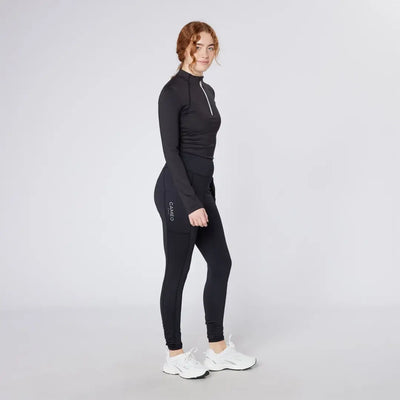 Woman in black athletic wear wearing Cameo Core Collection Tights for active look