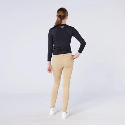Women’s long-sleeved black athletic top and tan skinny pants for season tights and country clothing