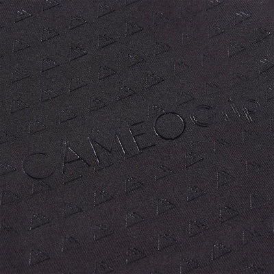 Black textured surface with embossed triangles and Cameo Junior Core Tights for outdoors style