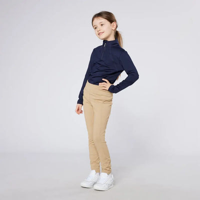 Girl in navy top and tan pants wearing Cameo Junior Core Tights style