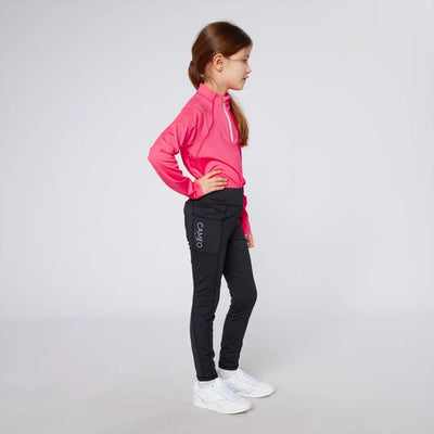 Girl wearing pink long-sleeved shirt and black leggings in Cameo Junior Core Tights, perfect for outdoors country clothing