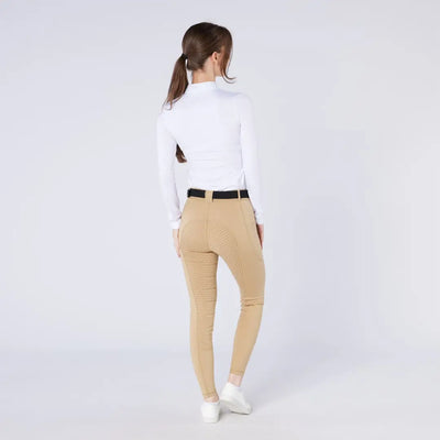 Women’s white mock neck top and tan riding pants for country clothing and outdoor riding