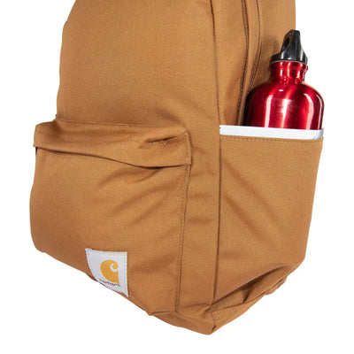 Brown Carhartt 21L Classic Laptop Backpack with red water bottle for country clothing and outdoors adventures