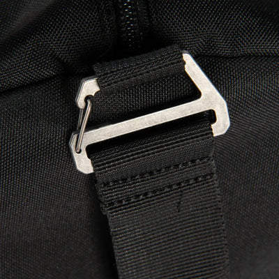 Black nylon strap with silver buckle on Carhartt 40L Classic duffel