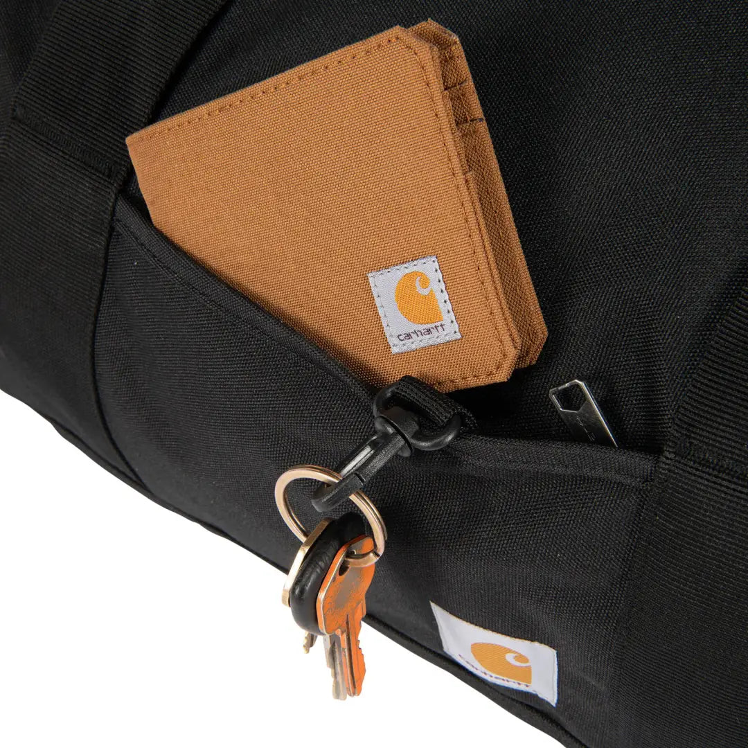 Brown Carhartt wallet with keychain loop in 40L Classic Round Duffel