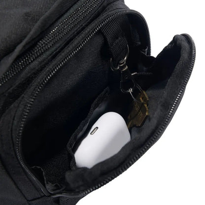 Black Carhartt Classic Waist Pack with nylon zipper pouch, earbuds and keys