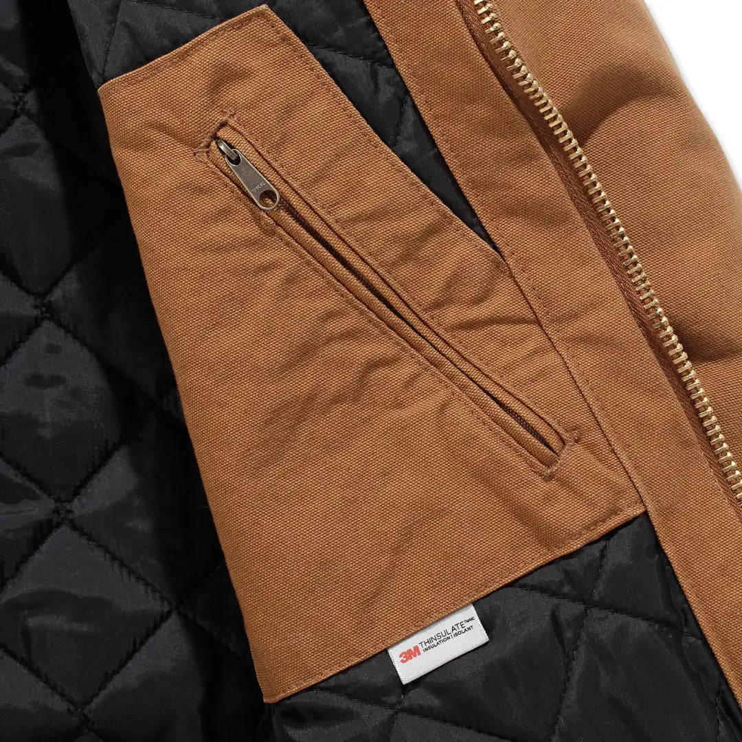 Brown jacket interior with zippered pocket, perfect for loose fit country clothing and hunting