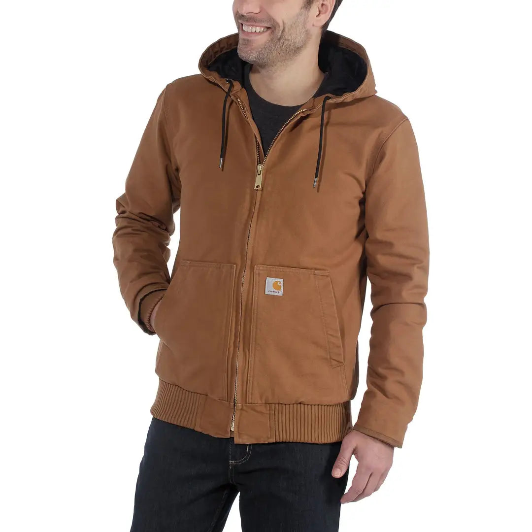 Brown hooded Carhartt jacket in loose fit for country clothing and hunting trips