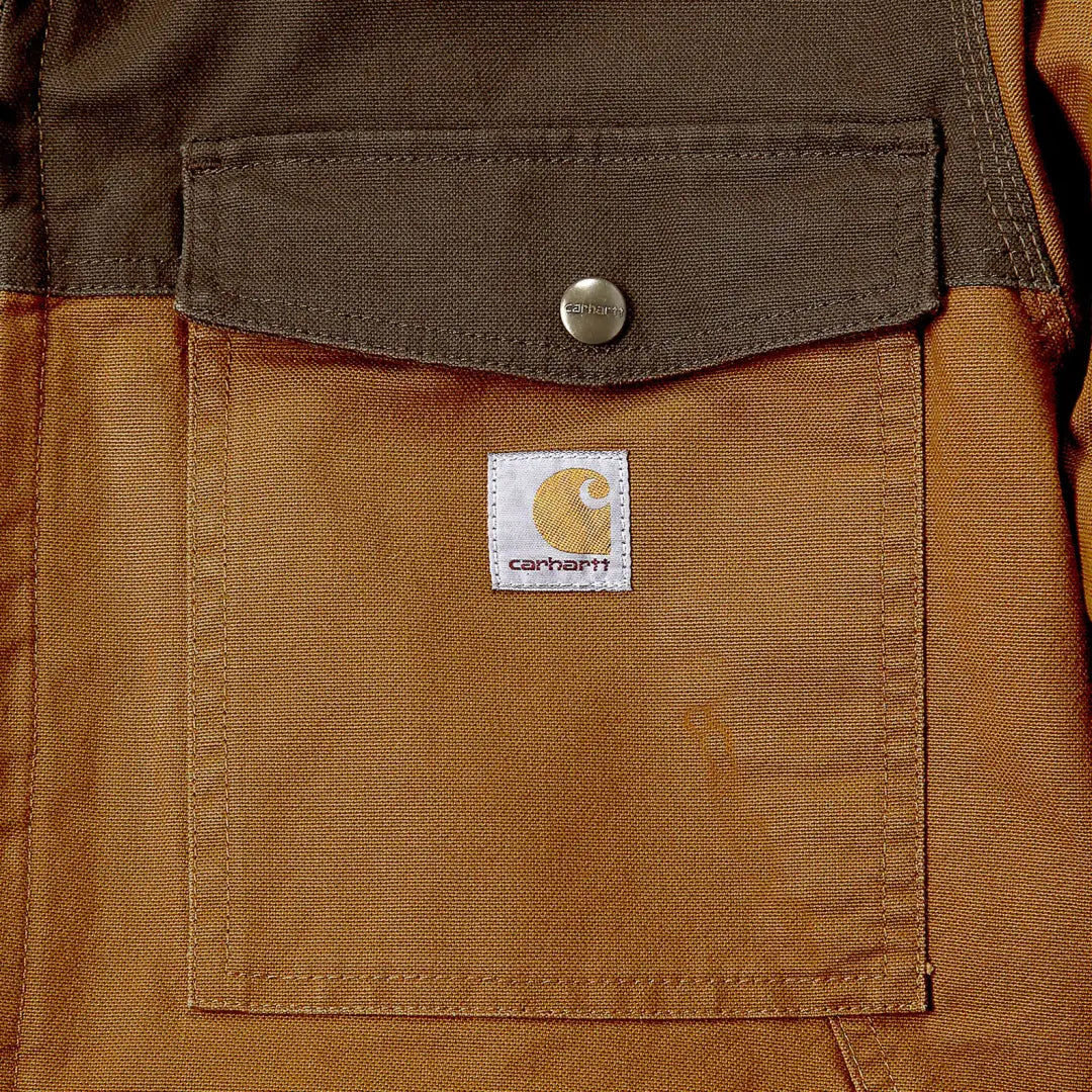 Brown Carhartt pocket on Montana Rugged Flex relaxed fit jacket for country hunting style