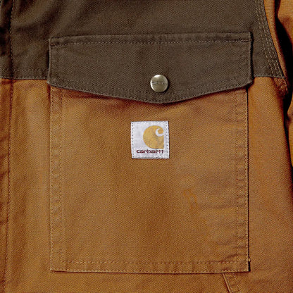 Brown Carhartt pocket on Montana Rugged Flex relaxed fit jacket for country hunting style
