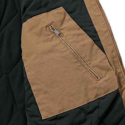 Brown jacket pocket with zipper on Carhartt Montana Rugged Flex relaxed fit duck vest for country hunting clothing
