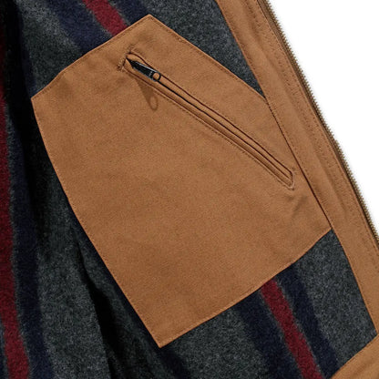 Carhartt relaxed fit Detroit jacket with brown corduroy zip pocket on striped sweater