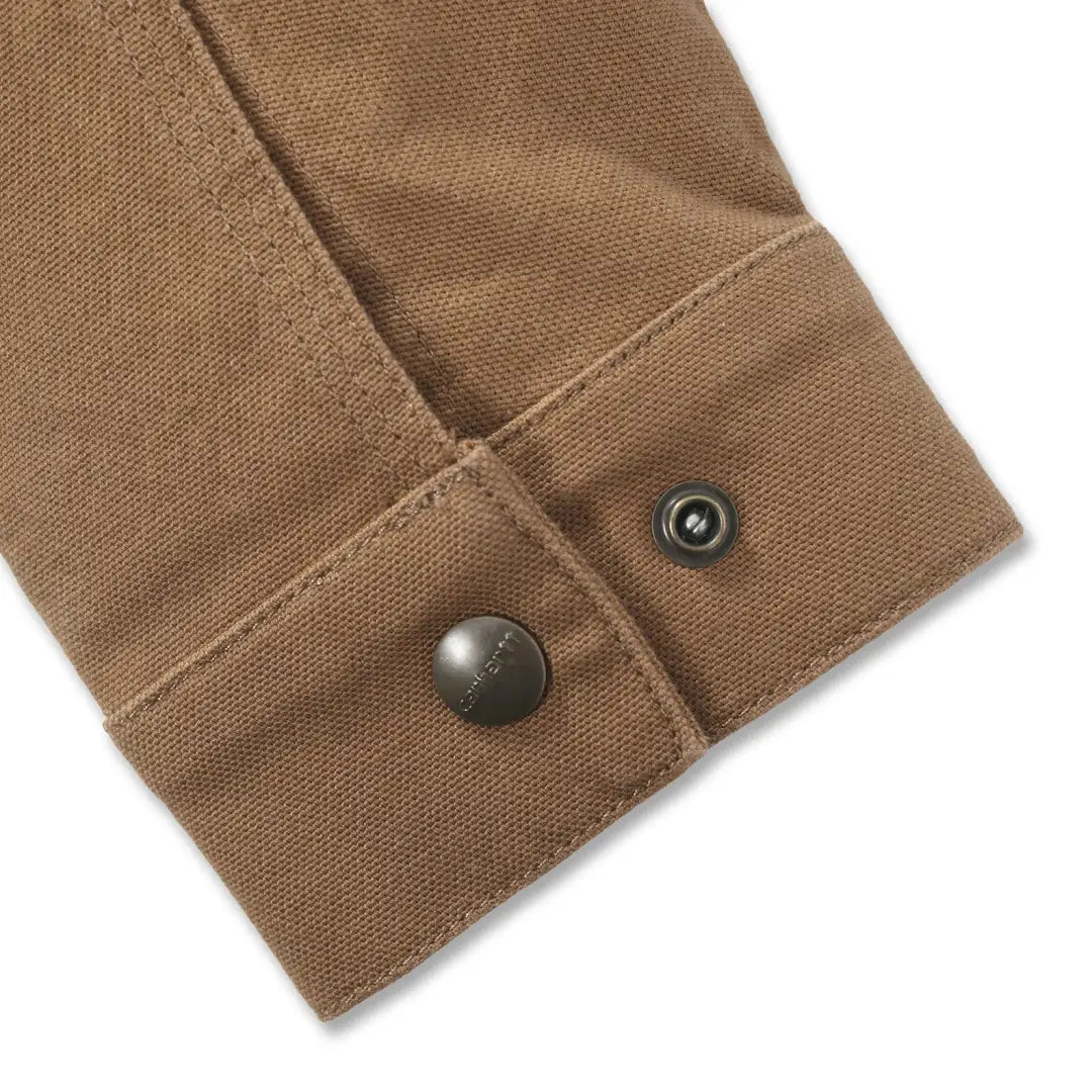 Tan sleeve of Carhartt Rugged Flex Duck Berwick Jacket with dark metal buttons