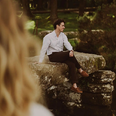 Man chilling on rocks in Chatham Deck II G2 Premium Leather Boat Shoes, part of bestselling G2 collection