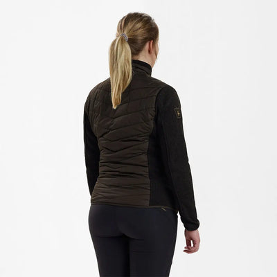 Woman’s black quilted vest paired with long-sleeved shirt in Deerhunter Lady Caroline Padded Jacket