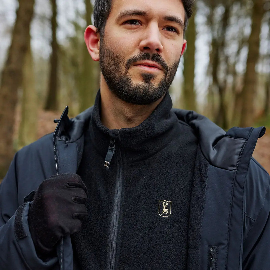 Man wearing Deerhunter Quinn Merino Gloves with a black jacket and fleece