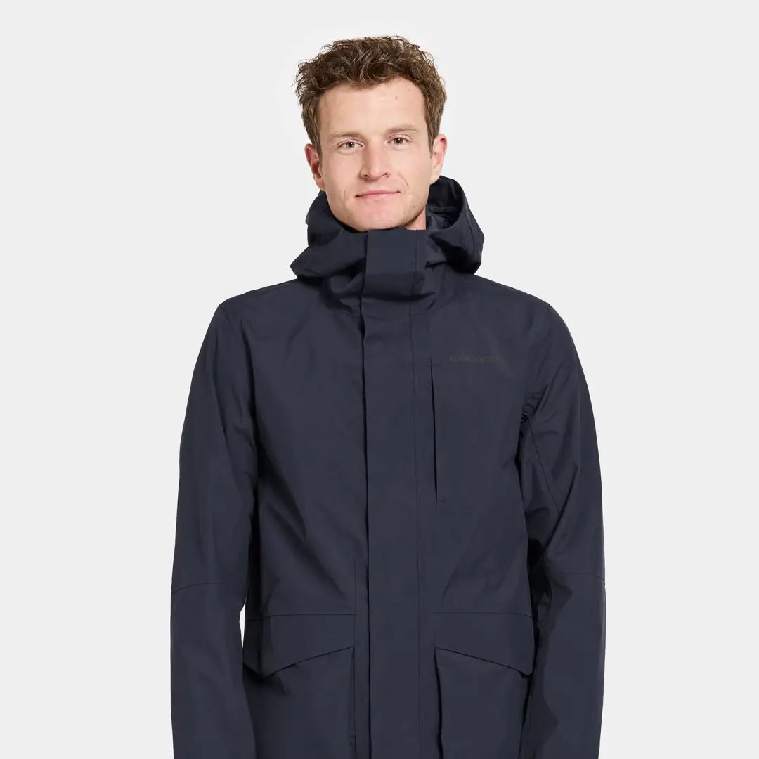 Man in navy Didriksons Andreas Parka 2, perfect for country clothing and outdoors