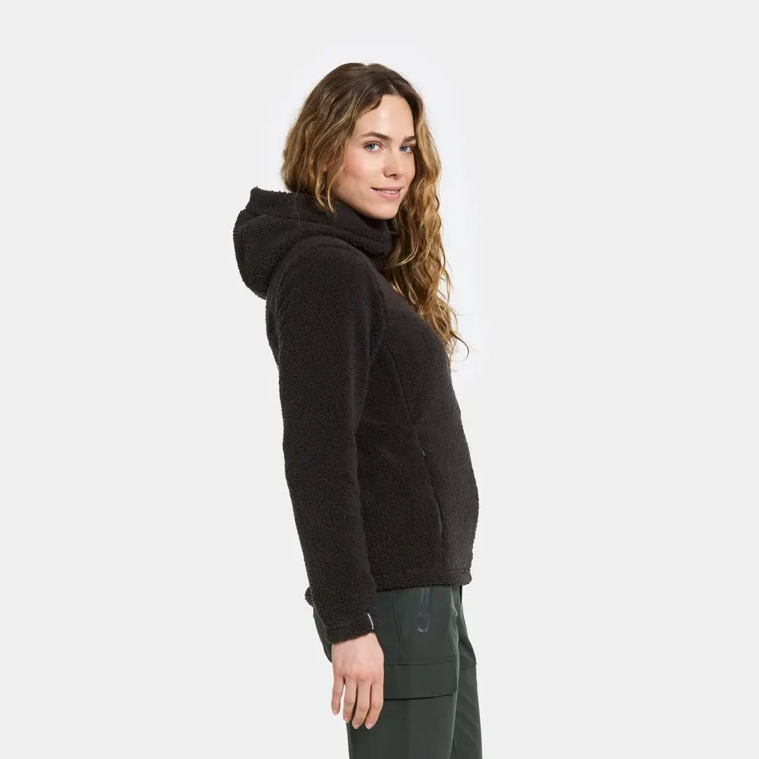 Woman in a black fleece hooded jacket, perfect for outdoors, hunting, or country clothing