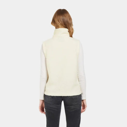 Woman wearing a cream Didriksons Kiana fleece vest perfect for country clothing outings
