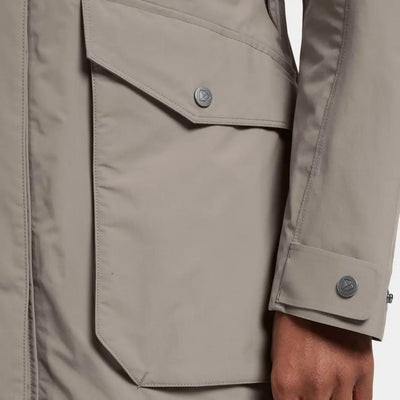Beige fully waterproof windproof parka with snap pockets and adjustable cuffs in iconic Didriksons style