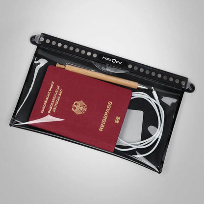Waterproof Fidlock Multi Dry Bag with passport and accessories for outdoor adventures